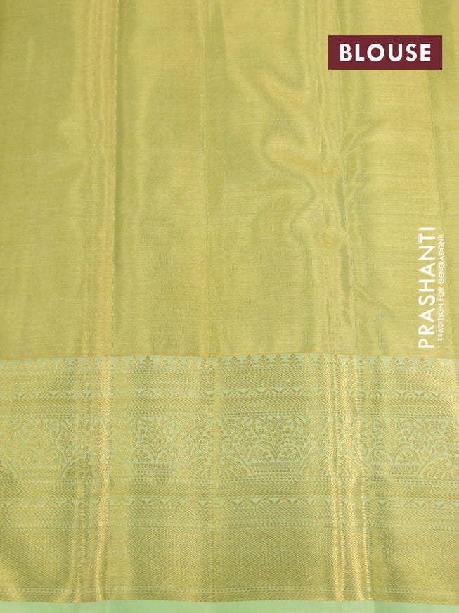 Kanchipuram tissue silk saree dual shade of lime yellow and pista green with allover zari woven brocade weaves and long zari woven border