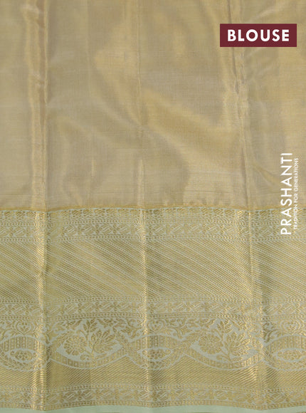 Kanchipuram tissue silk saree gold and mild pista green with allover zari woven brocade weaves and long zari woven border