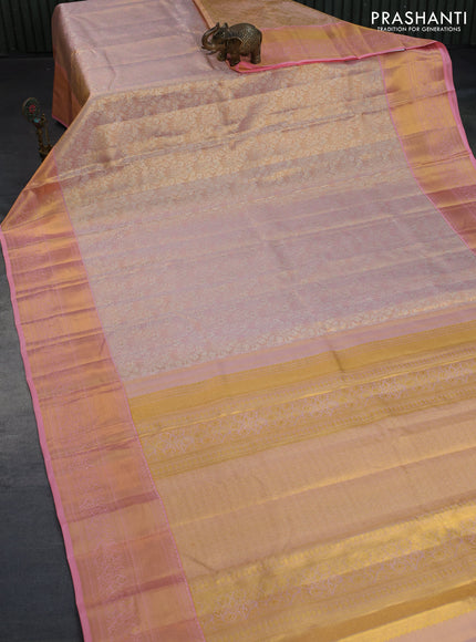 Kanchipuram tissue silk saree dual shade of peach and peach pink with allover silver zari woven brocade weaves and long zari woven border