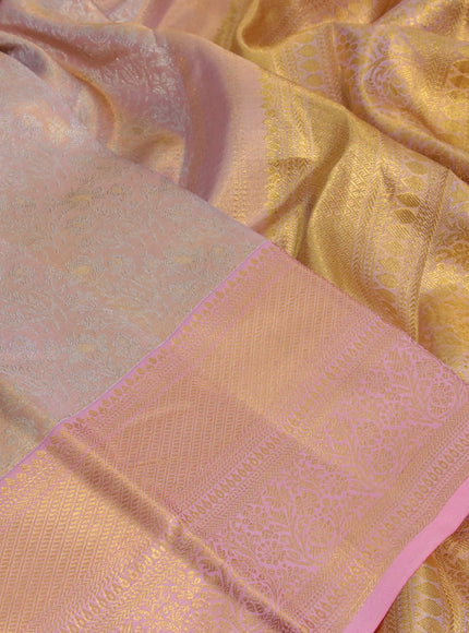 Kanchipuram tissue silk saree dual shade of peach and peach pink with allover silver zari woven brocade weaves and long zari woven border