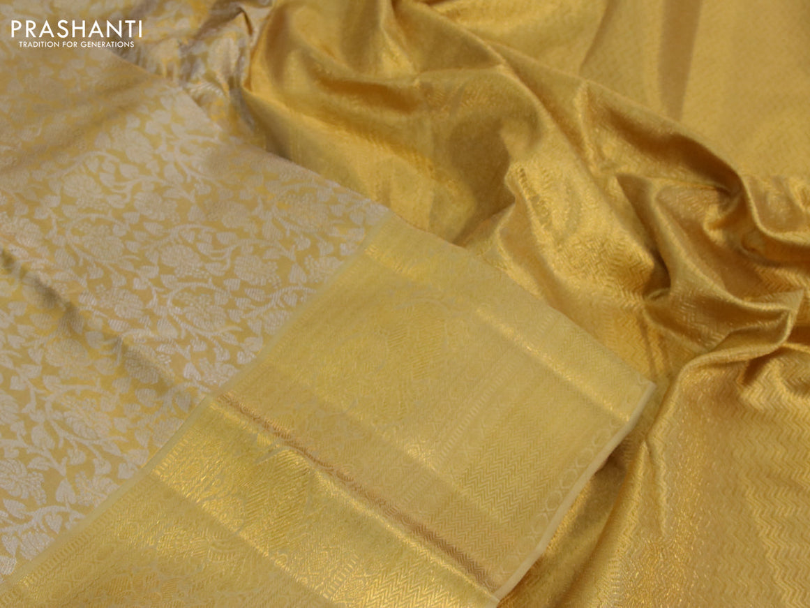 Kanchipuram tissue silk saree gold and sandal with allover silver zari woven brocade weaves and long zari woven border