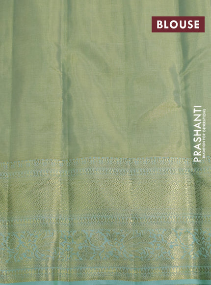 Kanchipuram tissue silk saree dual shade of teal and teal blue shade with allover zari woven brocade weaves and long zari woven border