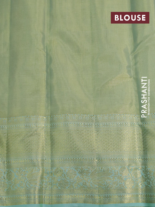 Kanchipuram tissue silk saree dual shade of teal and teal blue shade with allover zari woven brocade weaves and long zari woven border