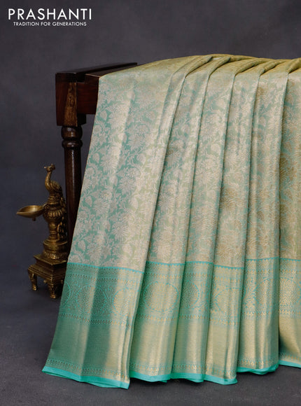 Kanchipuram tissue silk saree dual shade of teal blue with allover zari woven brocade weaves and long zari woven border