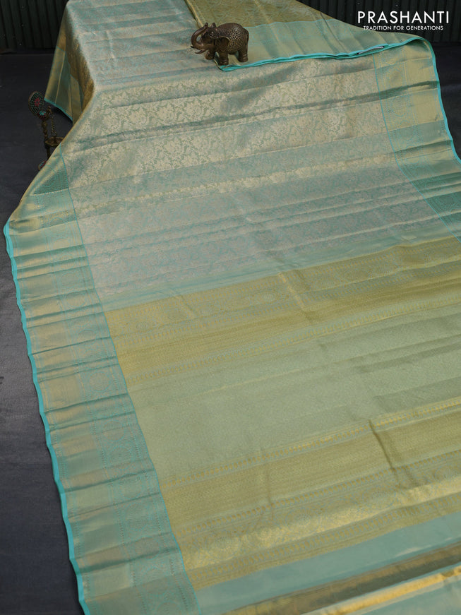 Kanchipuram tissue silk saree dual shade of teal blue with allover zari woven brocade weaves and long zari woven border