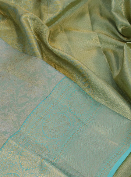 Kanchipuram tissue silk saree dual shade of teal blue with allover zari woven brocade weaves and long zari woven border