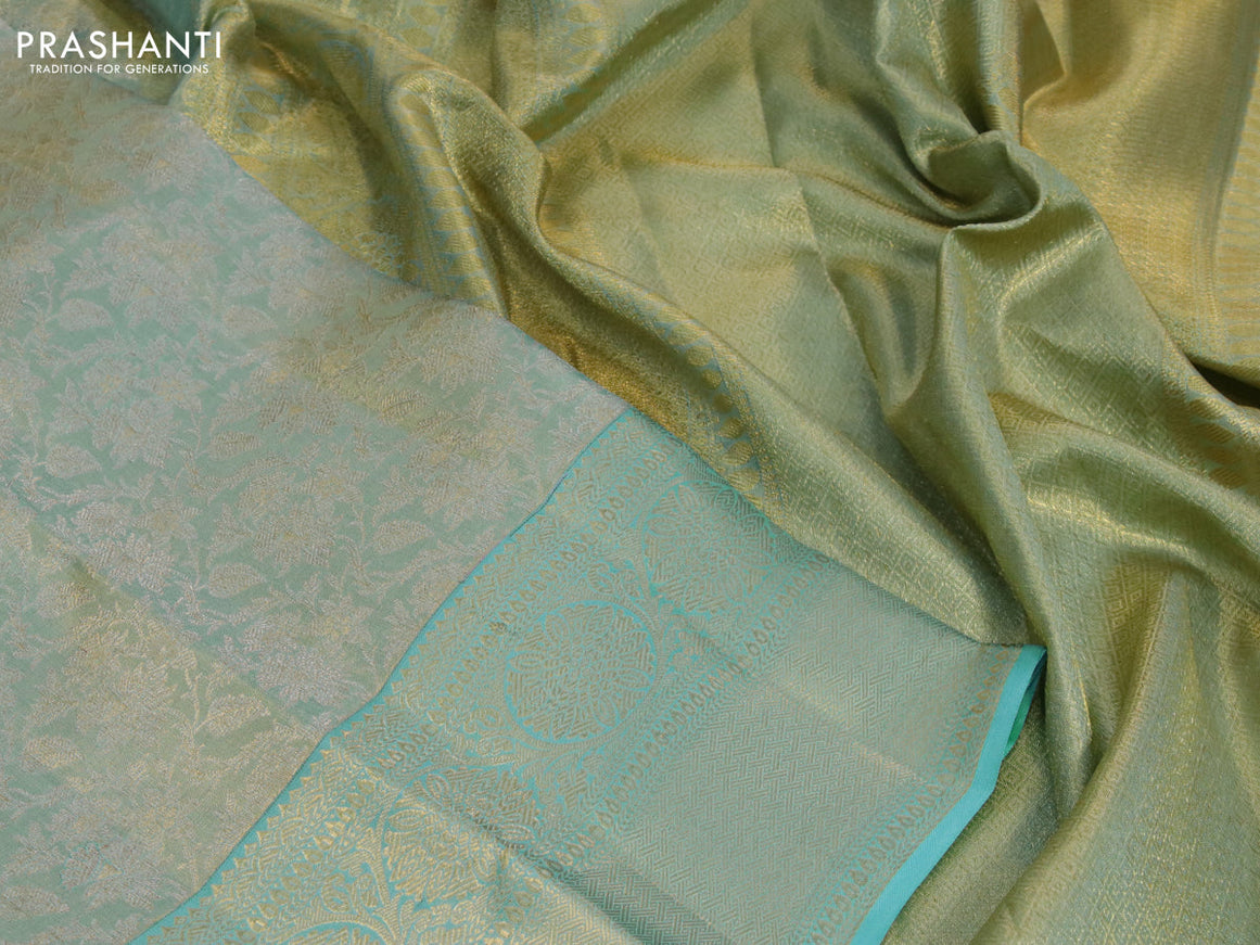 Kanchipuram tissue silk saree dual shade of teal blue with allover zari woven brocade weaves and long zari woven border