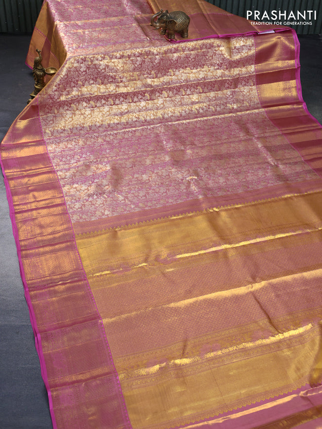 Kanchipuram tissue silk saree dual shade of peach and pink with allover zari woven floral brocade weaves and long zari woven border