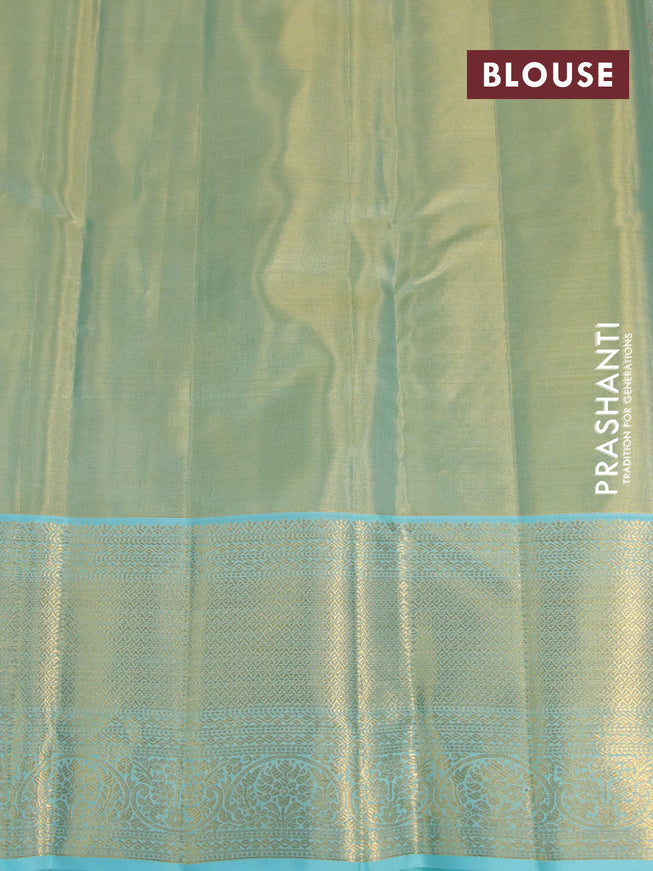 Kanchipuram tissue silk saree dual shade of bluish gold and teal blue with allover zari woven floral brocade weaves and zari woven border