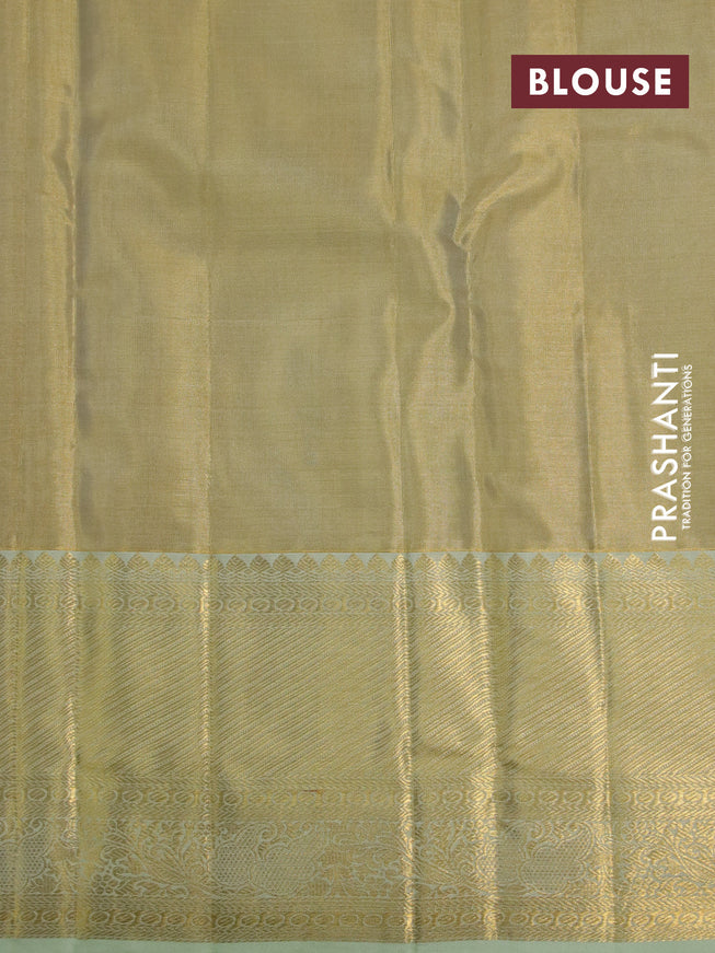 Kanchipuram tissue silk saree gold and mild pista green with allover zari woven brocade weaves and long zari woven border