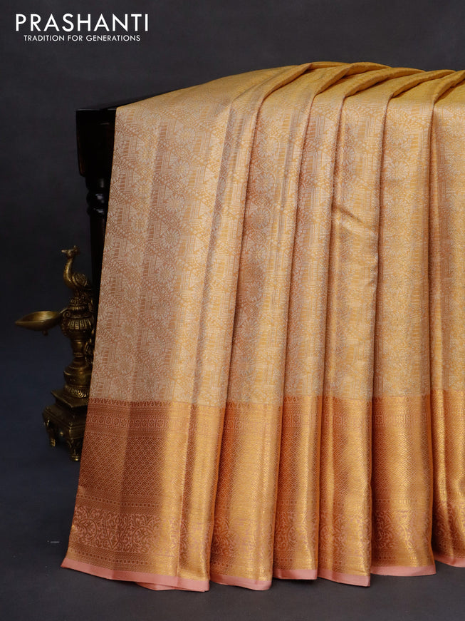 Kanchipuram tissue silk saree gold and pastel peach with allover silver zari woven brocade weaves and long zari woven border