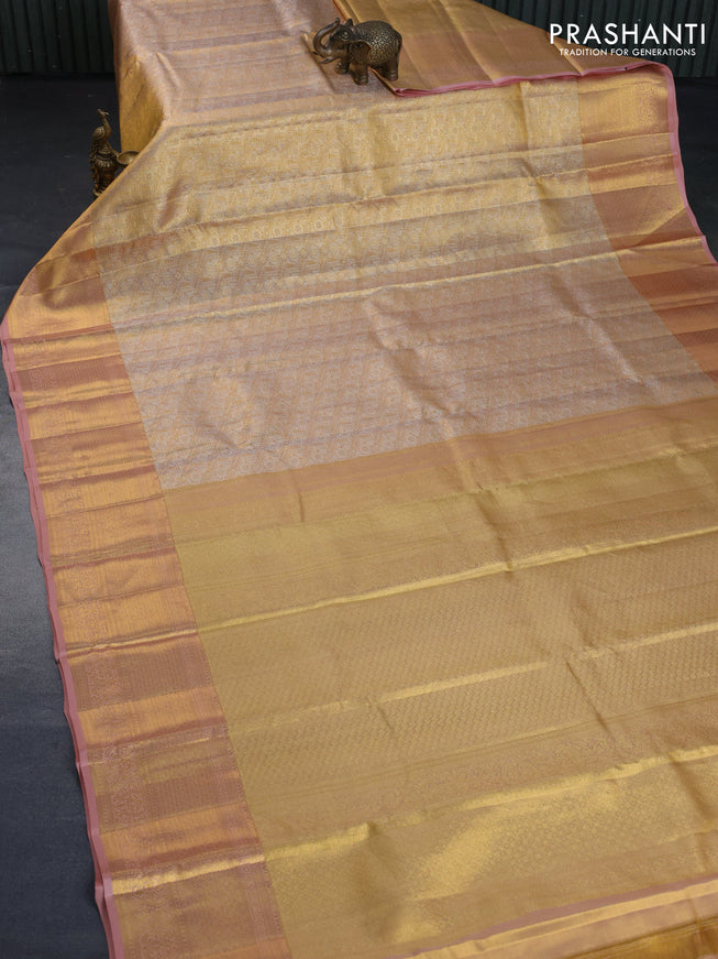 Kanchipuram tissue silk saree gold and pastel peach with allover silver zari woven brocade weaves and long zari woven border