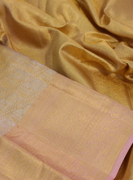 Kanchipuram tissue silk saree gold and pastel peach with allover silver zari woven brocade weaves and long zari woven border