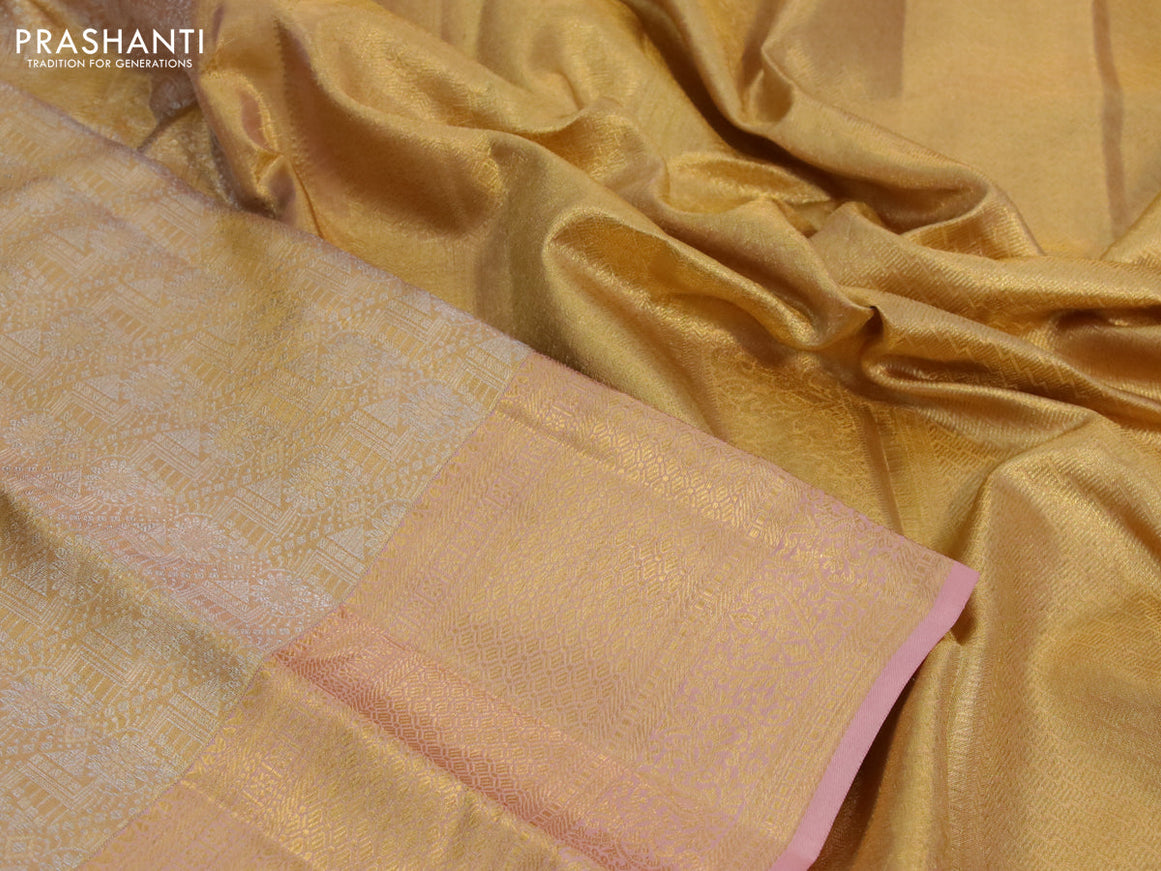 Kanchipuram tissue silk saree gold and pastel peach with allover silver zari woven brocade weaves and long zari woven border