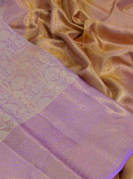 Kanchipuram tissue silk saree dual shade of mild lavender and lavender with allover zari woven brocade weaves and long zari woven border