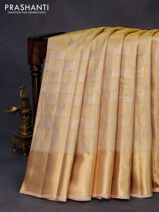 Kanchipuram tissue silk saree gold and sandal with allover zari woven geometric brocade weaves and zari woven border