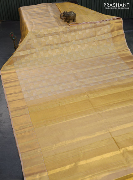 Kanchipuram tissue silk saree gold and sandal with allover zari woven geometric brocade weaves and zari woven border