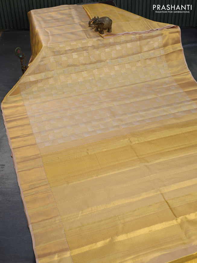 Kanchipuram tissue silk saree gold and sandal with allover zari woven geometric brocade weaves and zari woven border