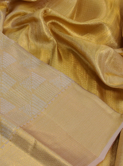 Kanchipuram tissue silk saree gold and sandal with allover zari woven geometric brocade weaves and zari woven border