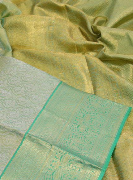 Kanchipuram tissue silk saree dual shade of teal and teal blue with allover zari woven brocade weaves and zari woven border