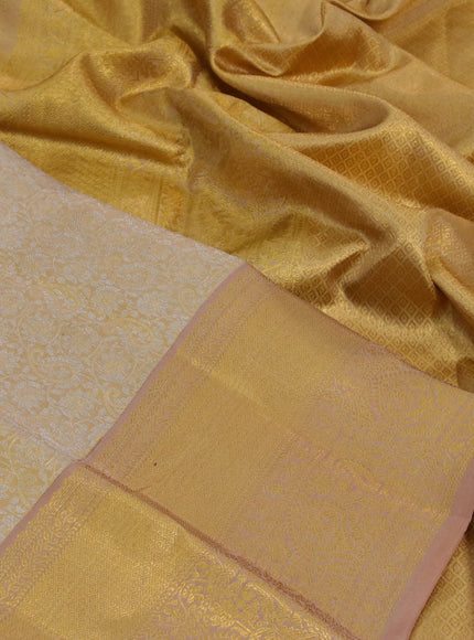 Kanchipuram tissue silk saree gold and dark sandal with allover silver zari woven brocade weaves and zari woven border