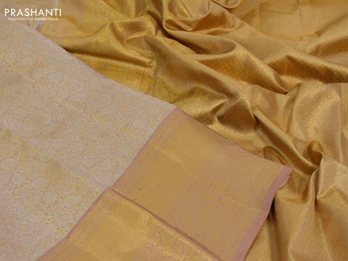 Kanchipuram tissue silk saree gold and dark sandal with allover silver zari woven brocade weaves and zari woven border