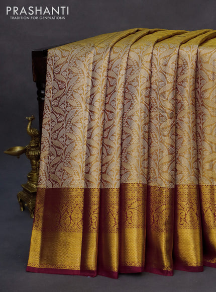 Kanchipuram tissue silk saree gold and maroon with allover silver zari woven brocade weaves and zari woven border