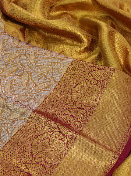 Kanchipuram tissue silk saree gold and maroon with allover silver zari woven brocade weaves and zari woven border