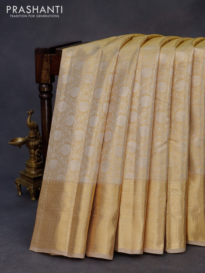 Kanchipuram tissue silk saree gold and beige with allover zari woven floral brocade weaves and zari woven border