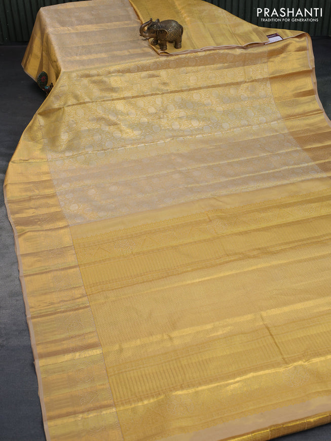 Kanchipuram tissue silk saree gold and beige with allover zari woven floral brocade weaves and zari woven border