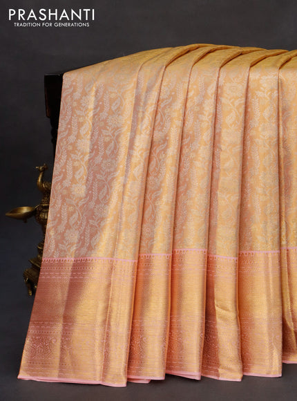 Kanchipuram tissue silk saree dual shade of gold and light pink with allover silver zari woven brocade weaves and zari woven border