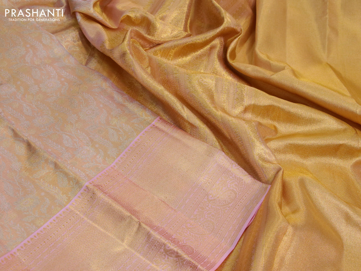 Kanchipuram tissue silk saree dual shade of gold and light pink with allover silver zari woven brocade weaves and zari woven border