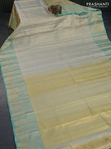 Kanchipuram tissue silk saree dual shade of teal blue with allover silver zari woven brocade weaves and zari woven border