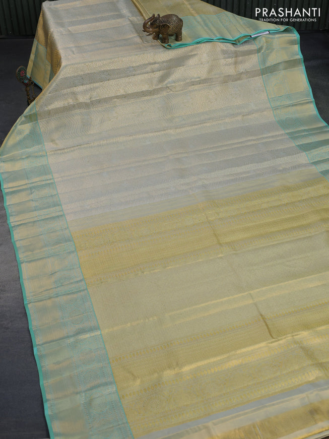 Kanchipuram tissue silk saree dual shade of teal blue with allover silver zari woven brocade weaves and zari woven border