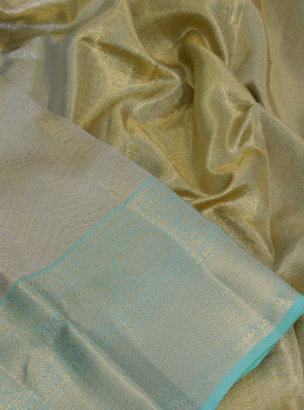 Kanchipuram tissue silk saree dual shade of teal blue with allover silver zari woven brocade weaves and zari woven border