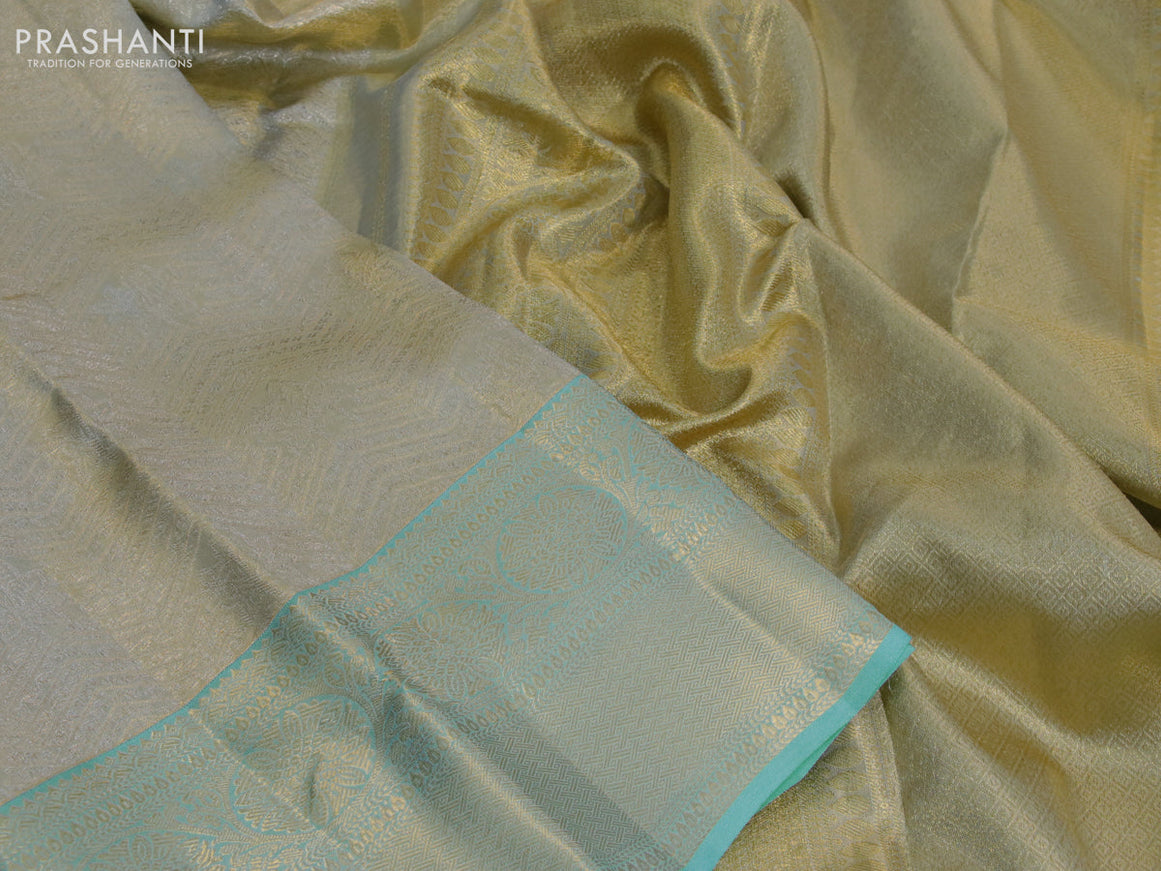 Kanchipuram tissue silk saree dual shade of teal blue with allover silver zari woven brocade weaves and zari woven border