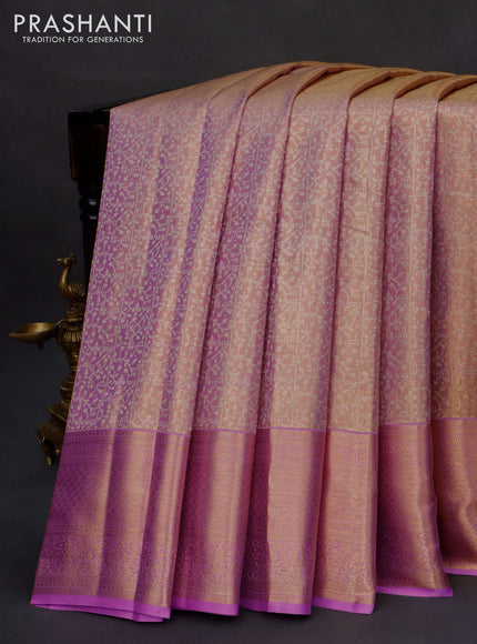 Kanchipuram tissue silk saree dual shade of mild lavender and lavender with allover zari woven brocade weaves and zari woven border