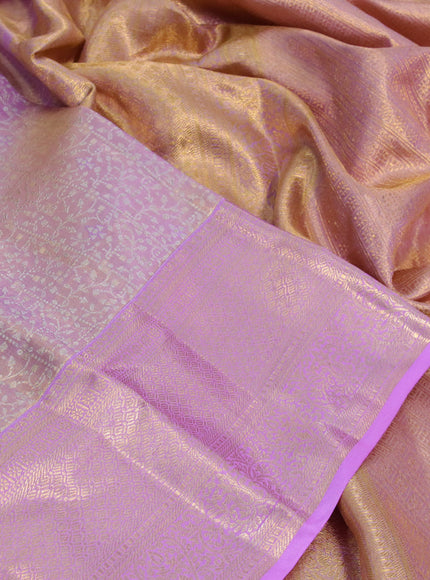 Kanchipuram tissue silk saree dual shade of mild lavender and lavender with allover zari woven brocade weaves and zari woven border