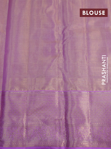 Kanchipuram tissue silk saree dual shade of mild lavender and lavender with allover zari woven brocade weaves and zari woven border