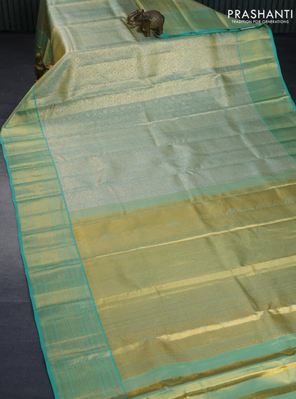 Kanchipuram tissue silk saree dual shade of teal blue with allover silver zari woven brocade weaves and zari woven border