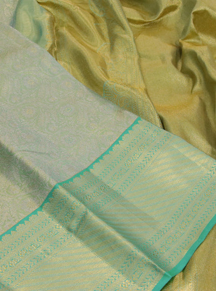 Kanchipuram tissue silk saree dual shade of teal blue with allover silver zari woven brocade weaves and zari woven border