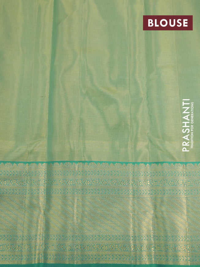 Kanchipuram tissue silk saree dual shade of teal blue with allover silver zari woven brocade weaves and zari woven border