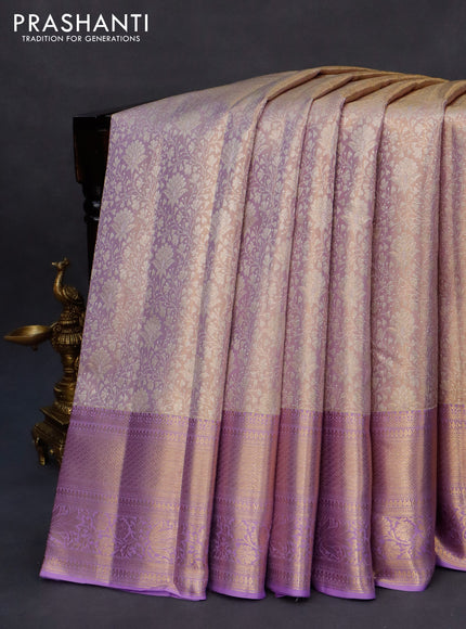 Kanchipuram tissue silk saree dual shade of mild lavender with allover silver zari woven brocade weaves and long zari woven border