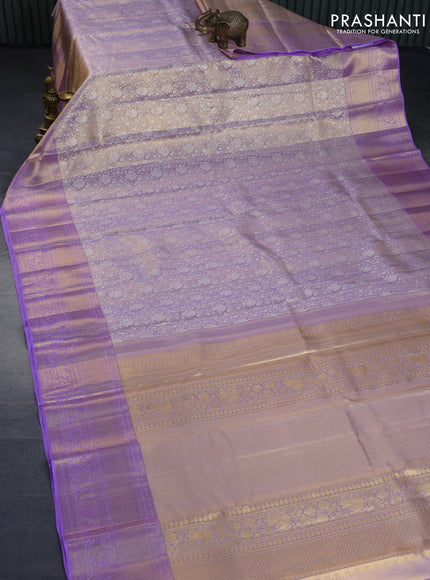 Kanchipuram tissue silk saree dual shade of mild lavender with allover silver zari woven brocade weaves and long zari woven border