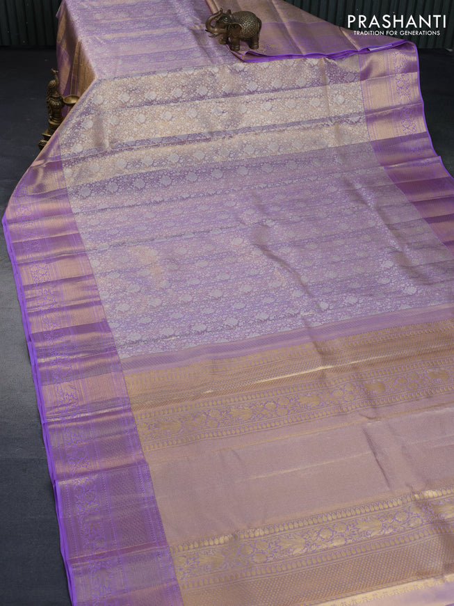 Kanchipuram tissue silk saree dual shade of mild lavender with allover silver zari woven brocade weaves and long zari woven border