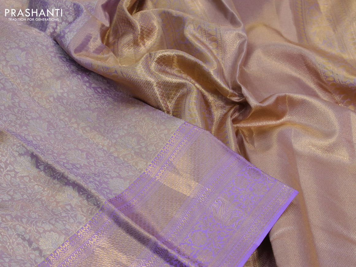 Kanchipuram tissue silk saree dual shade of mild lavender with allover silver zari woven brocade weaves and long zari woven border