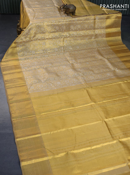 Kanchipuram tissue silk saree gold and sandal with allover silver zari woven brocade weaves and long zari woven border