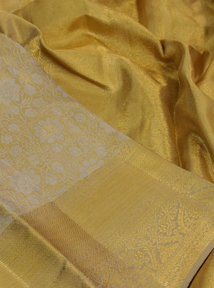 Kanchipuram tissue silk saree gold and sandal with allover silver zari woven brocade weaves and long zari woven border