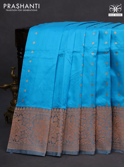 Banarasi katan silk saree light blue shade and grey with copper zari woven buttas and copper zari woven border