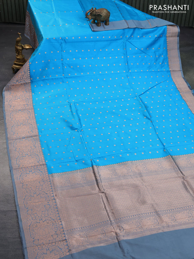 Banarasi katan silk saree light blue shade and grey with copper zari woven buttas and copper zari woven border